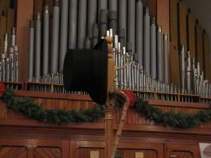 Scrooge's hat and cane on the coat rack...